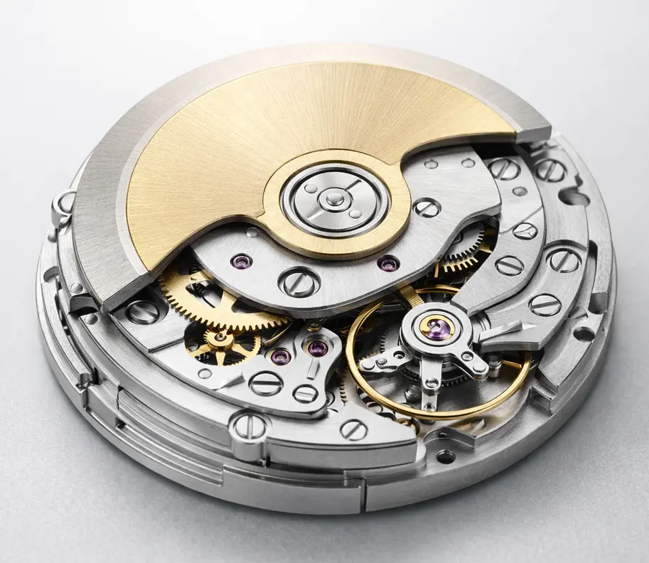 Close-up view of a generic automatic mechanical watch movement with visible gears and rotor